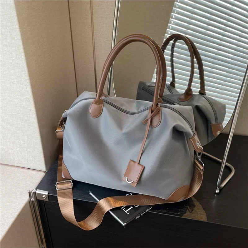 Casual Concise Large Capacity Solid Color Oxford Spinning Travel Bag 2025 New Versatile Shoulder Bag Commuter Crossbody Bag