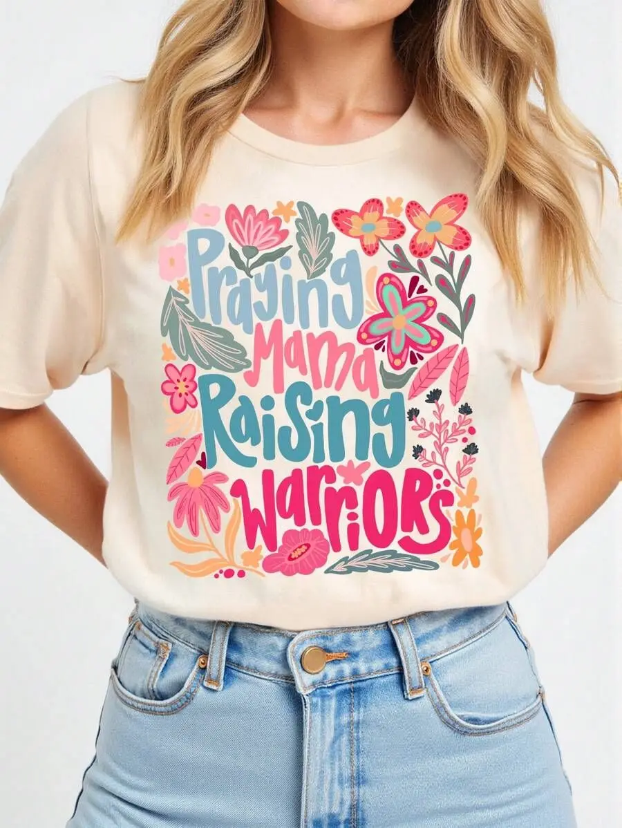 

Plus - Size Motherhood Inspirational Tee, Short - Sleeve with “Praying Mama Raising Warriors” & Floral Design