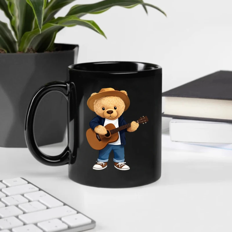 The teddy bear coffee cup, a black cartoon bear playing guitar design, is suitable for home, office and as a gift.