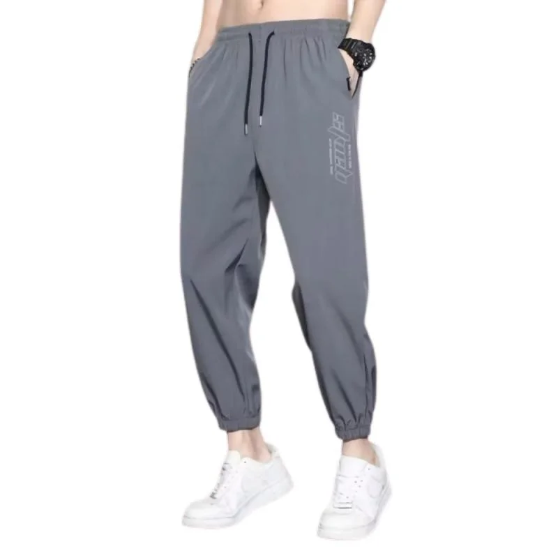Pantaloni lunghi casual sottili estivi da uomo in seta di ghiaccio Pantaloni sportivi con risvolto allentato Qui Dry Pantaloni sportivi a nove punti Faionable Loose Fit