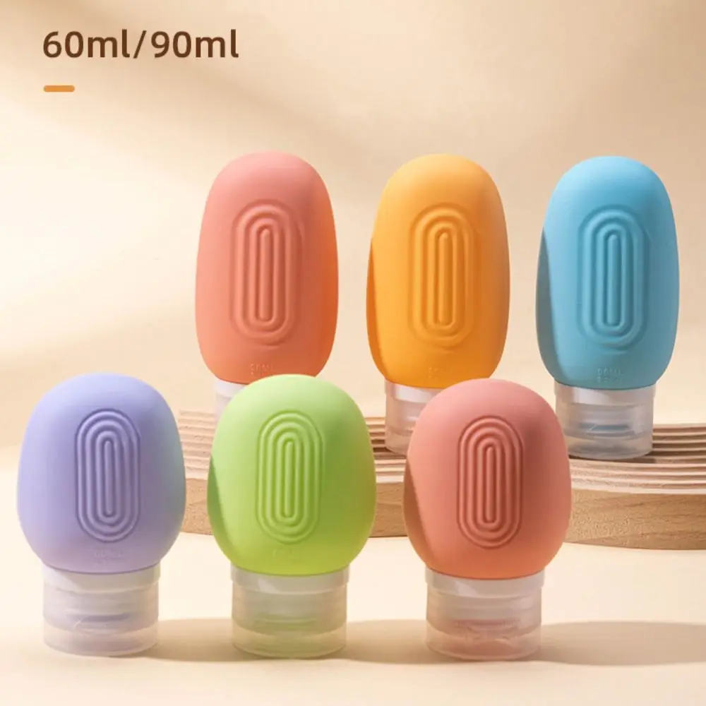 Nouveau 60/90ml bouteille vide rechargeable Silicone salle de bain presser Tube bouteille Lotion shampooing conteneur voyage Lotion shampooing bouteille