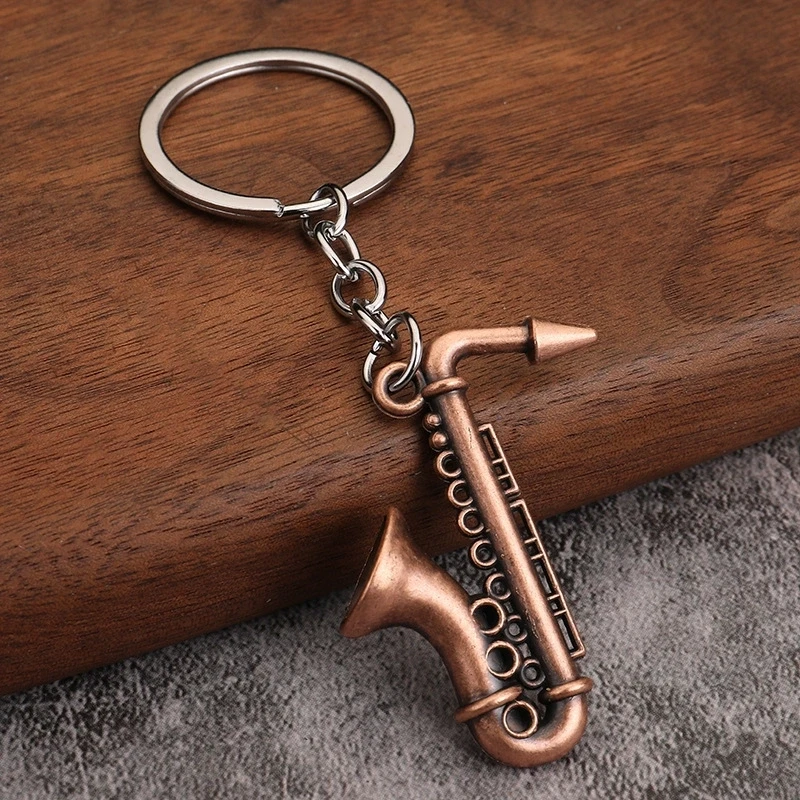 Wholesale mini musical instruments, toys, saxophones, metal keychains, pendants, music gifts