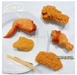 Roasted chicken legs, chicken wings, hair clips with fake food on the edge, funny fried barbecue, french fries, hair clips
