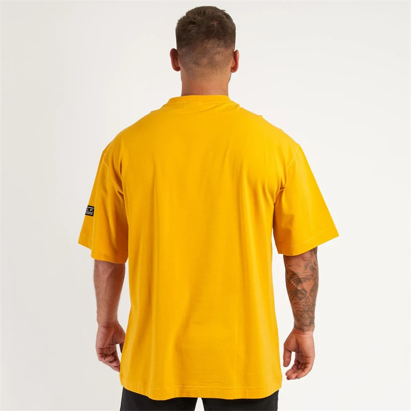 Camiseta holgada de manga corta para hombre, ropa deportiva de algodón con cuello redondo, informal, a la moda, para hacer ejercicio en el gimnasio,