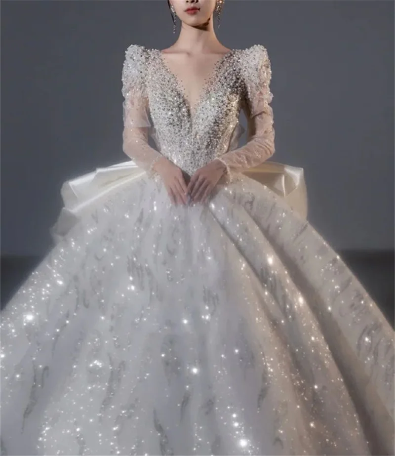 Dubai Arabia Luxury Ball Gown Wedding Dress Crystal Sequin Pearl Bridal Gown V Neck Long Sleeves Butterfly Back Robe De Mariée