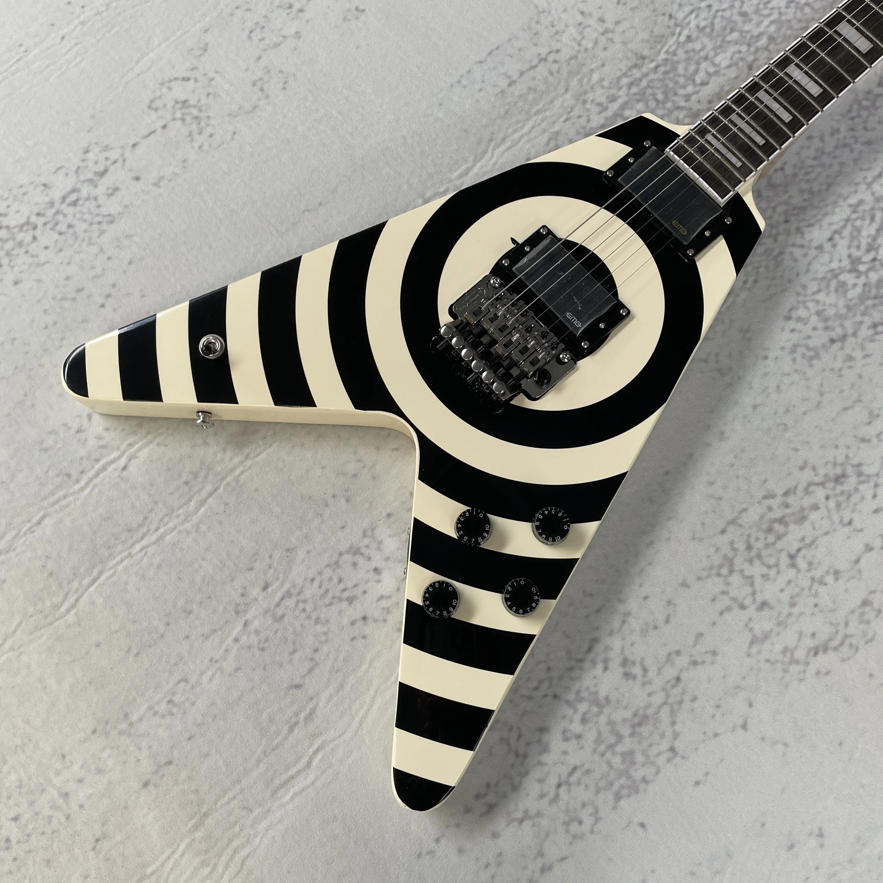 V Shape Electric Guitar, Black White Bullseye Pattern, Dual Closed Humbuckers, Double Locking Tremolo, 22 Frets, New