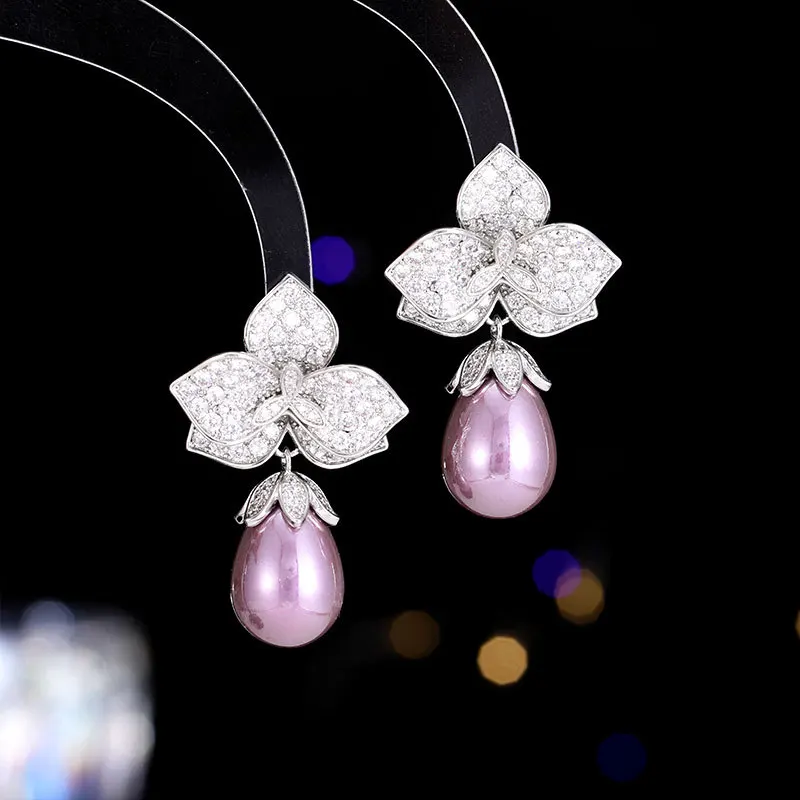 

Light luxury and fashionable design earrings, zircon micro-inlaid petal-shaped teardrop-shaped pearl S925 silver needle earrings