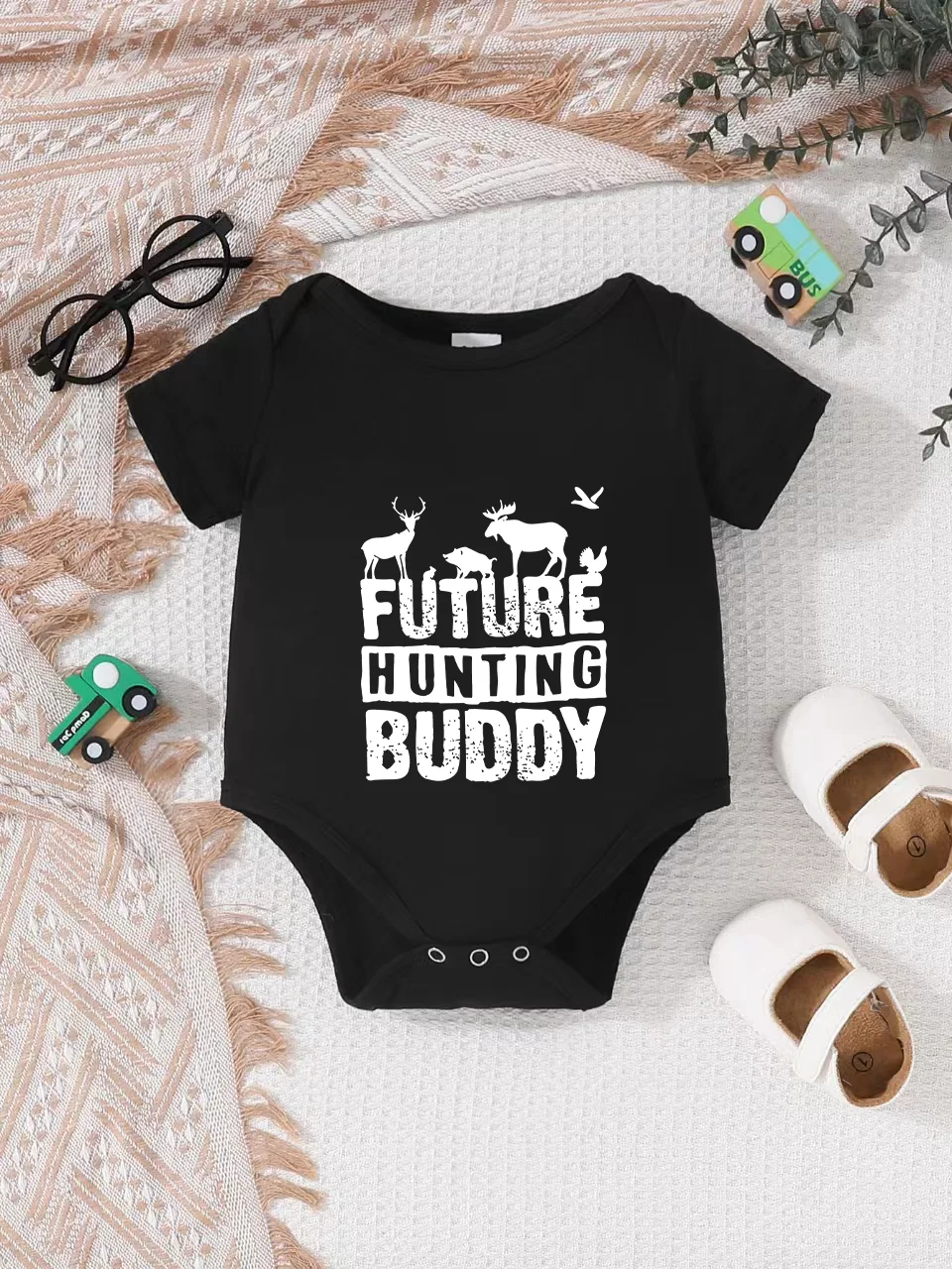 Playful letter-printed baby short-sleeve triangle bodysuit. Button closure for easy dressing