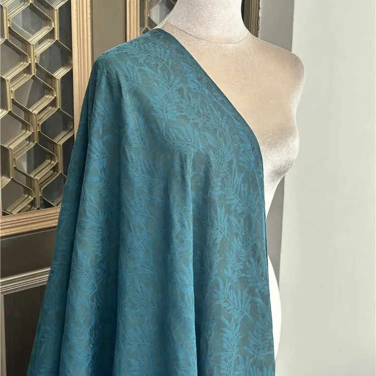 

Limited Peacock Blue 39momme Leaf Jacquard Silk Spun Fragrant Cloud Yarn 100% Silk Skirt Trench Coat Fabric Textile