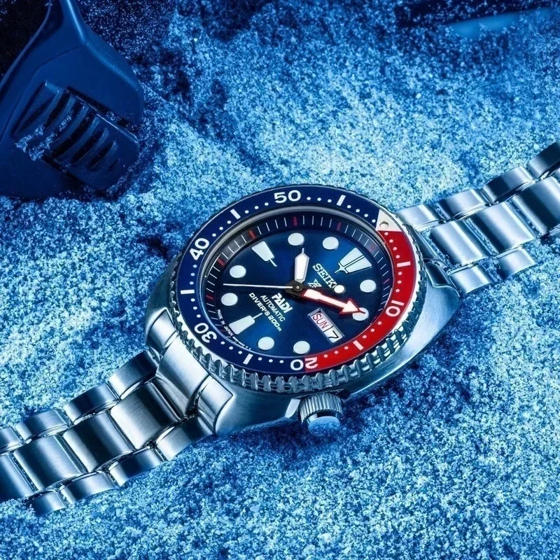 ساعة Seiko للرجال PADI SRPE99 Water Ghost أوتوماتيكية ميكانيكية ساعة غوص بحزام فضي وإطار أزرق وأحمر