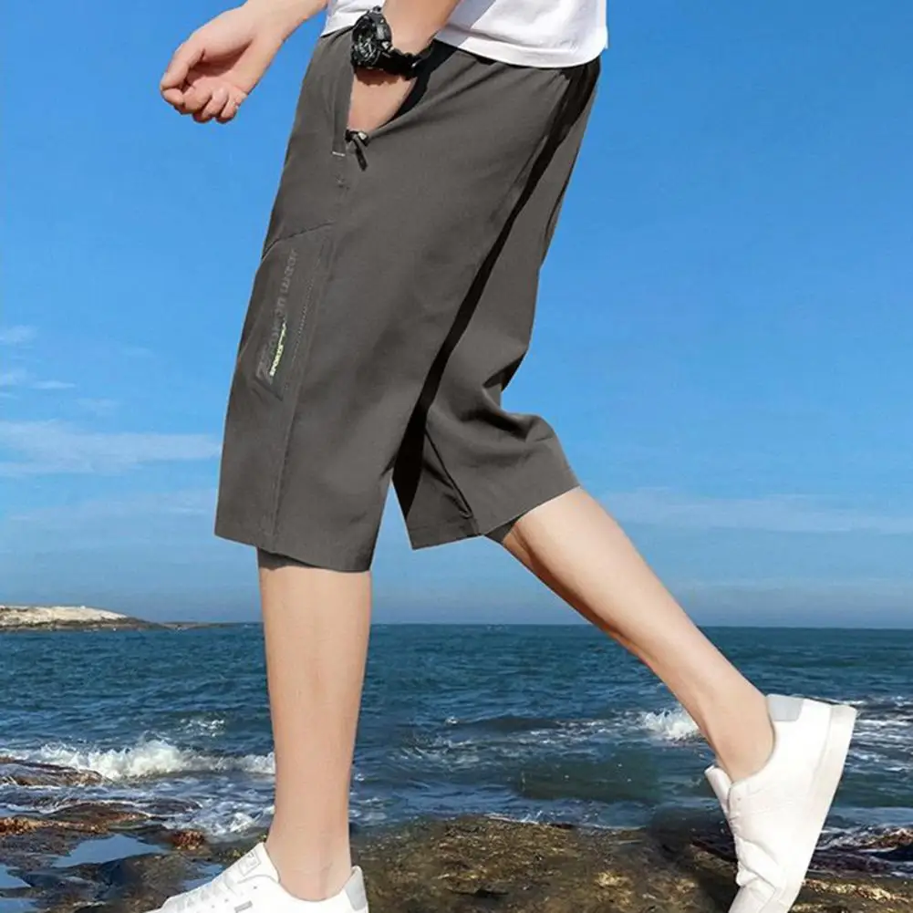 Men Cropped Pants Loose Elastic Waist Ice Silk Loose Pants Solid Color Breathable Mid Waist Mid-calf Length Trousers With Pocket