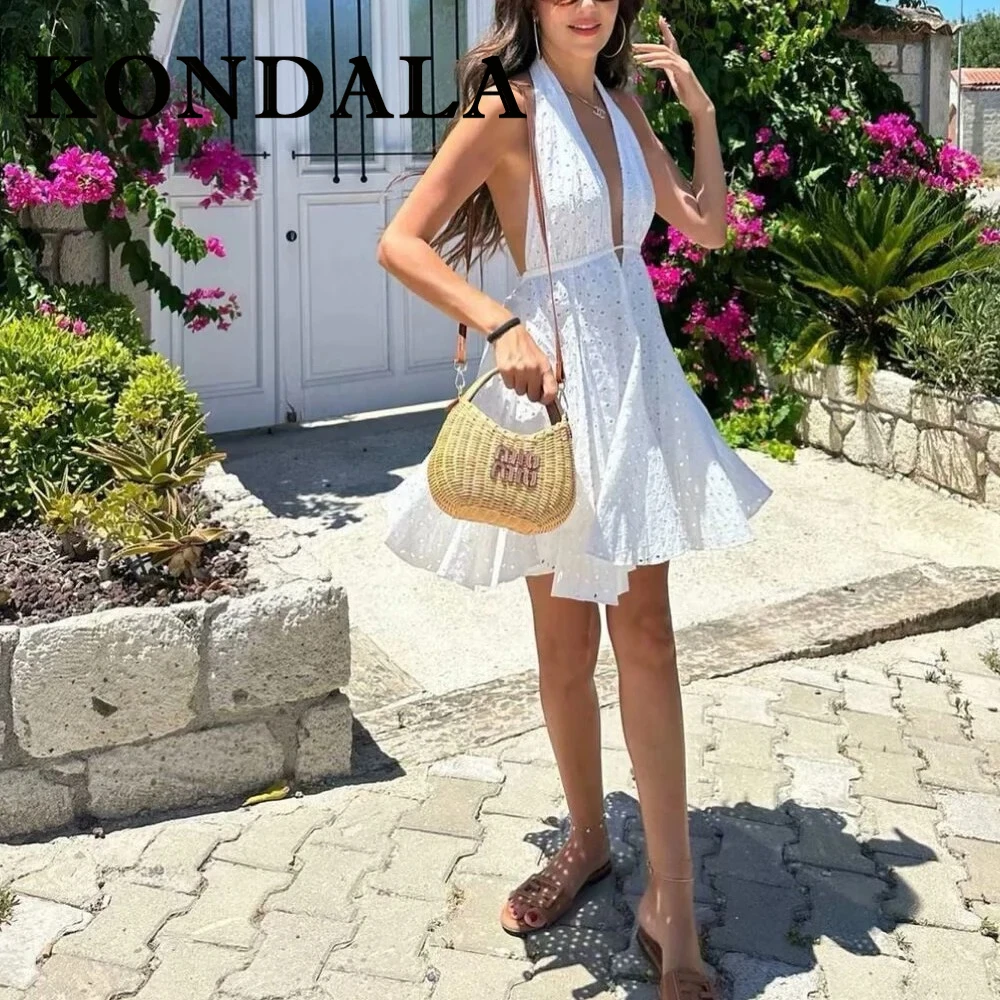 فستان KONDALA أنيق أبيض مفرغ للنساء موضة 2025 فستان صيفي مطرز برقبة على شكل حرف v بدون ظهر ثنيات فستان نسائي صغير