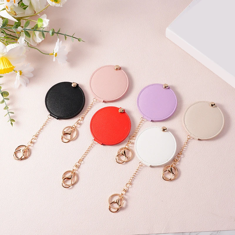 PU-leer Ultradunne ronde make-upspiegel Roestvrij staal Dubbelzijdige cosmetische spiegel Opvouwbare zak Compacte spiegel voor op reis