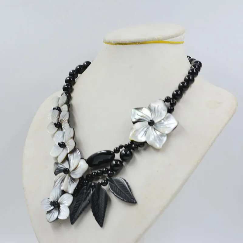 Fashion women's jewelry. Natural black stone and natural shell flower necklace 19 inches