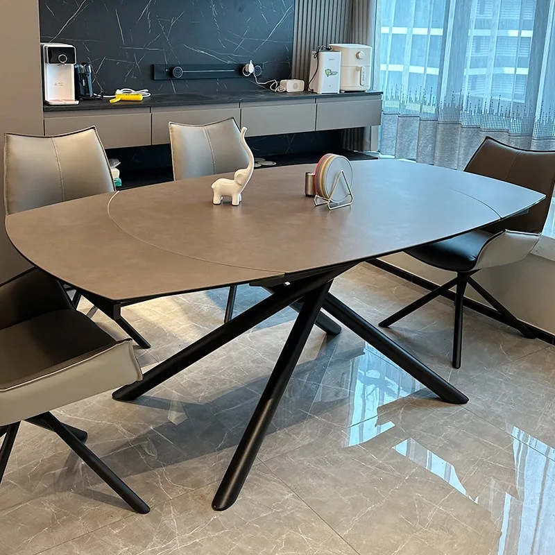

Italian minimalist imported Calais rock slab retractable dining table modern simple living room oval rotating dining table