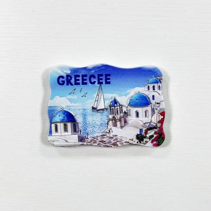 distinctive blue and white circular building of Santorini, Greece, is a magnetic refrigerator sticker, a high-value decorati