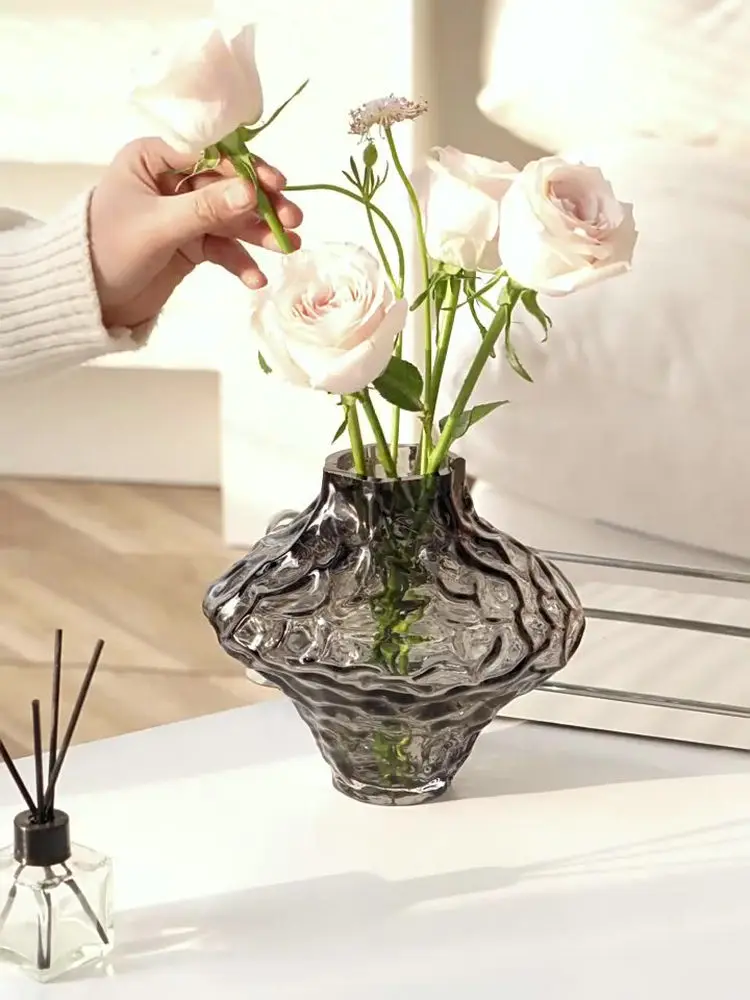 

Creative Valley glass vase with irregular and unique design, a craft item for home decor and flower arrangement