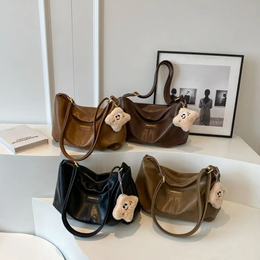 

Elegant PU Dumpling Bag with Cute Pendant Large Capacity Casual Crossbody Bag Soft Leather Versatile Underarm Shoulder Bag
