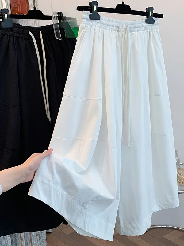 ゆったりとしたワイドレッグパンツ、怠惰なスタイル、ルーズカフ、薄い夏のカジュアルな七分丈スカート、女性用プラスサイズのズボン、快適なフィット感