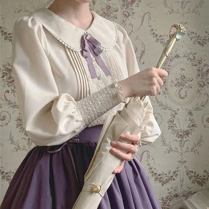 قمصان كلاسيكية أنيقة على طراز لوليتا للسيدات بلوزات مطرزة بالدانتيل بأكمام حلوة فستان بفيونكة لطيف للسيدات 2025 تخفيضات هائلة