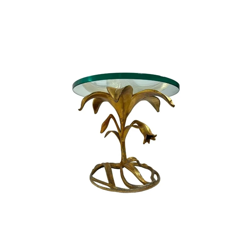 

Decorated center table with aluminum floral details and glass surfaces, perfect for