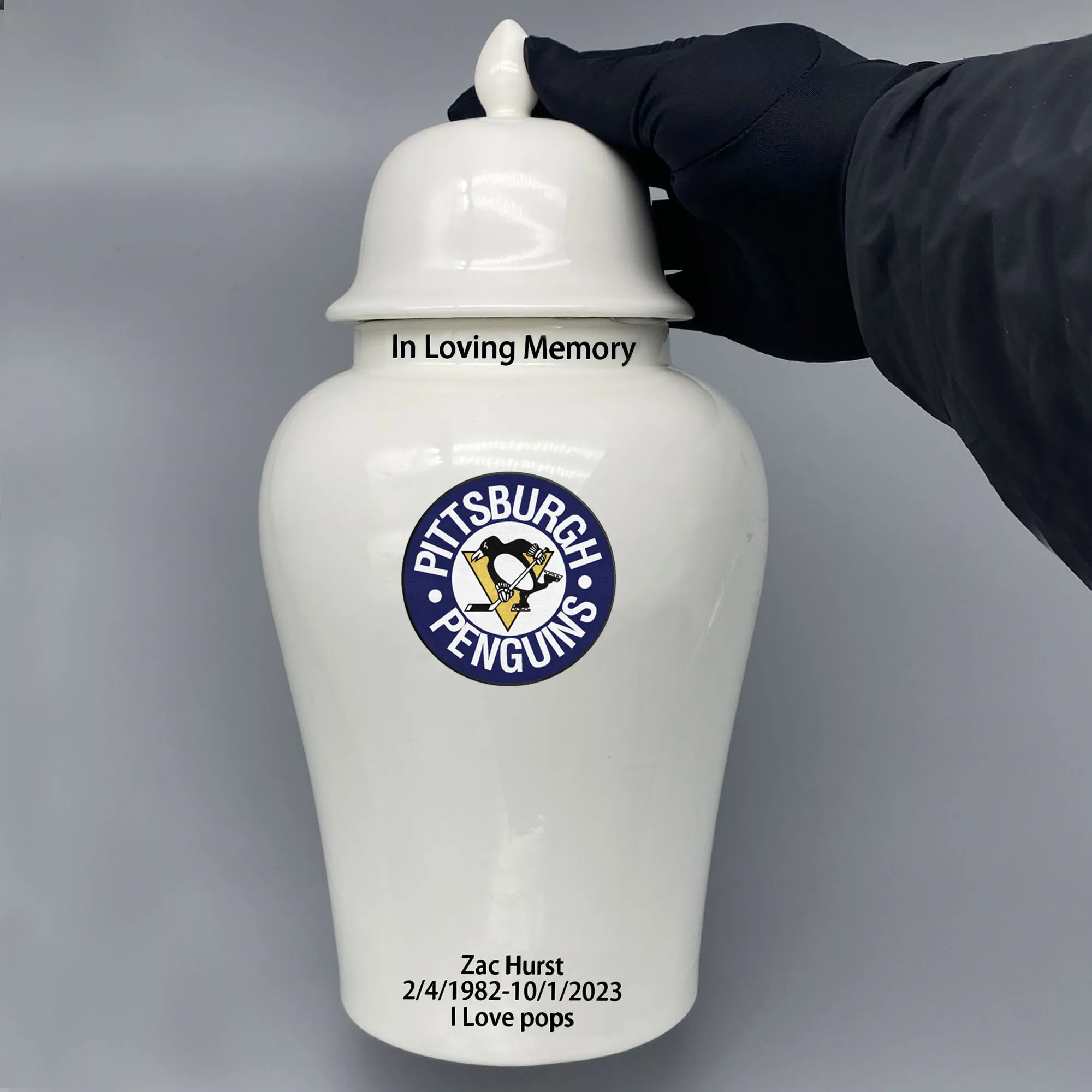 

Large Urn for Pittsburgh Penguins-themed Hockey Urn.Please send me the customize information-name/date