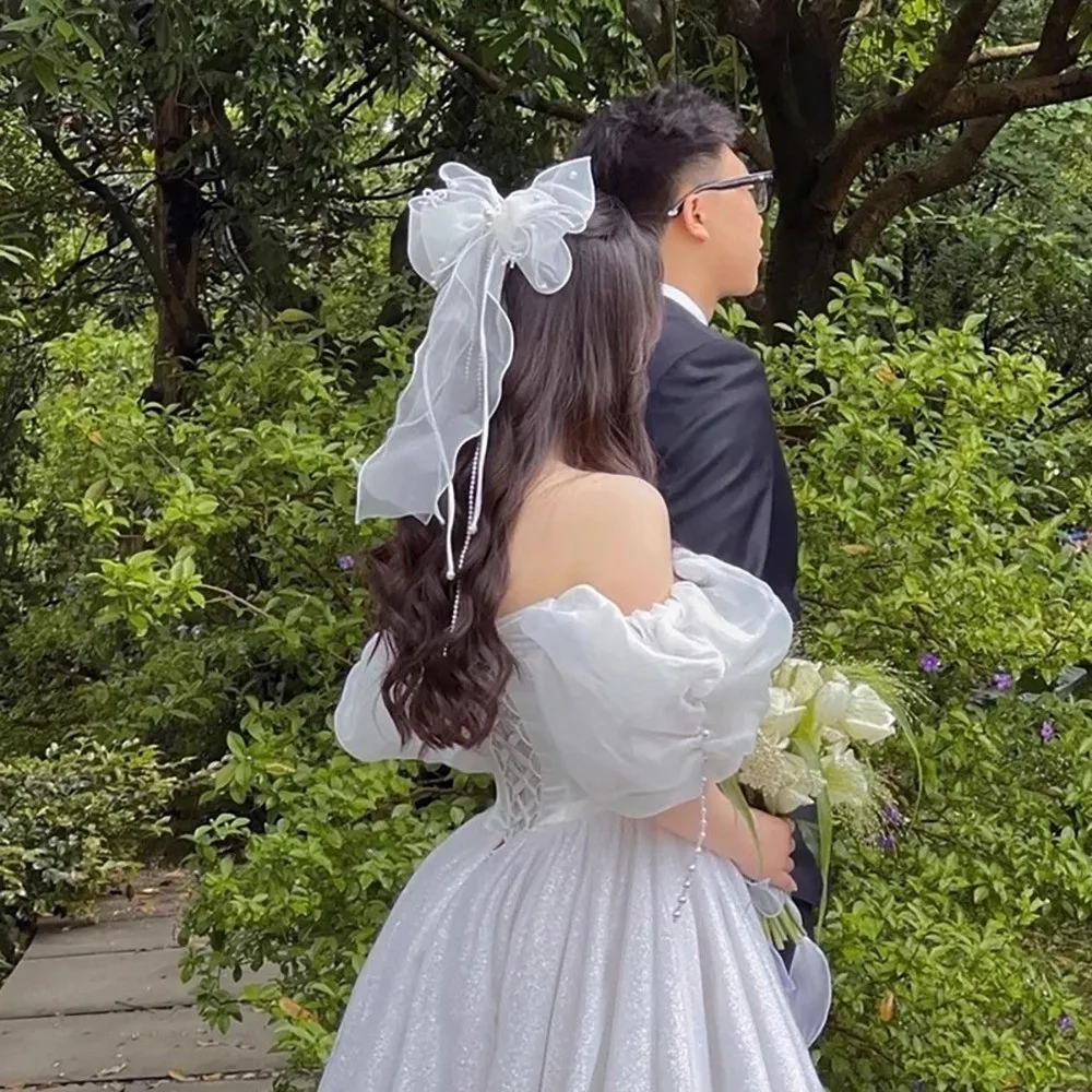 أزياء اللؤلؤ الزفاف الشريط القوس دبوس الشعر ضوء فاخر أنيق الزفاف أغطية الرأس الجنية شرابة الزفاف غطاء الرأس الزفاف