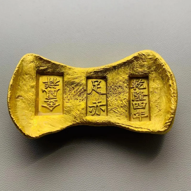 -plated gold ingot ornament from Qianlong tenth year of the Qing Dynasty, a hand-held piece for attracting wealth, with
