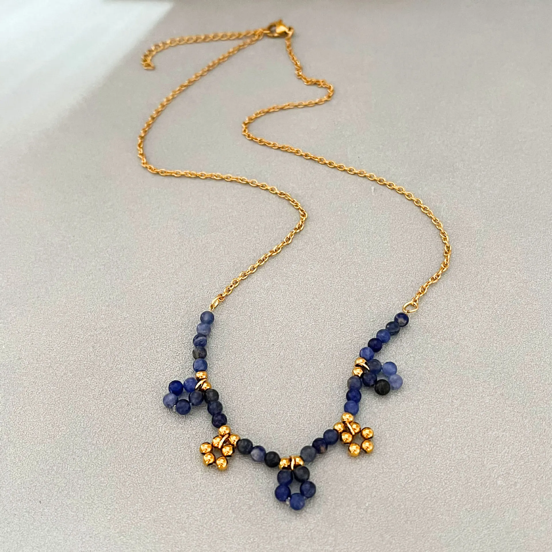 Stainless steel blue stone necklace bracelet high-end light luxury simple flower clavicle chain wholesale women