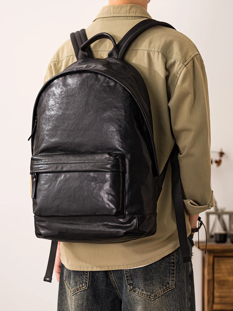 

PNDME simple casual luxury genuine leather men's large capacity backpacks outdoor travel designer cow leather laptop black bag