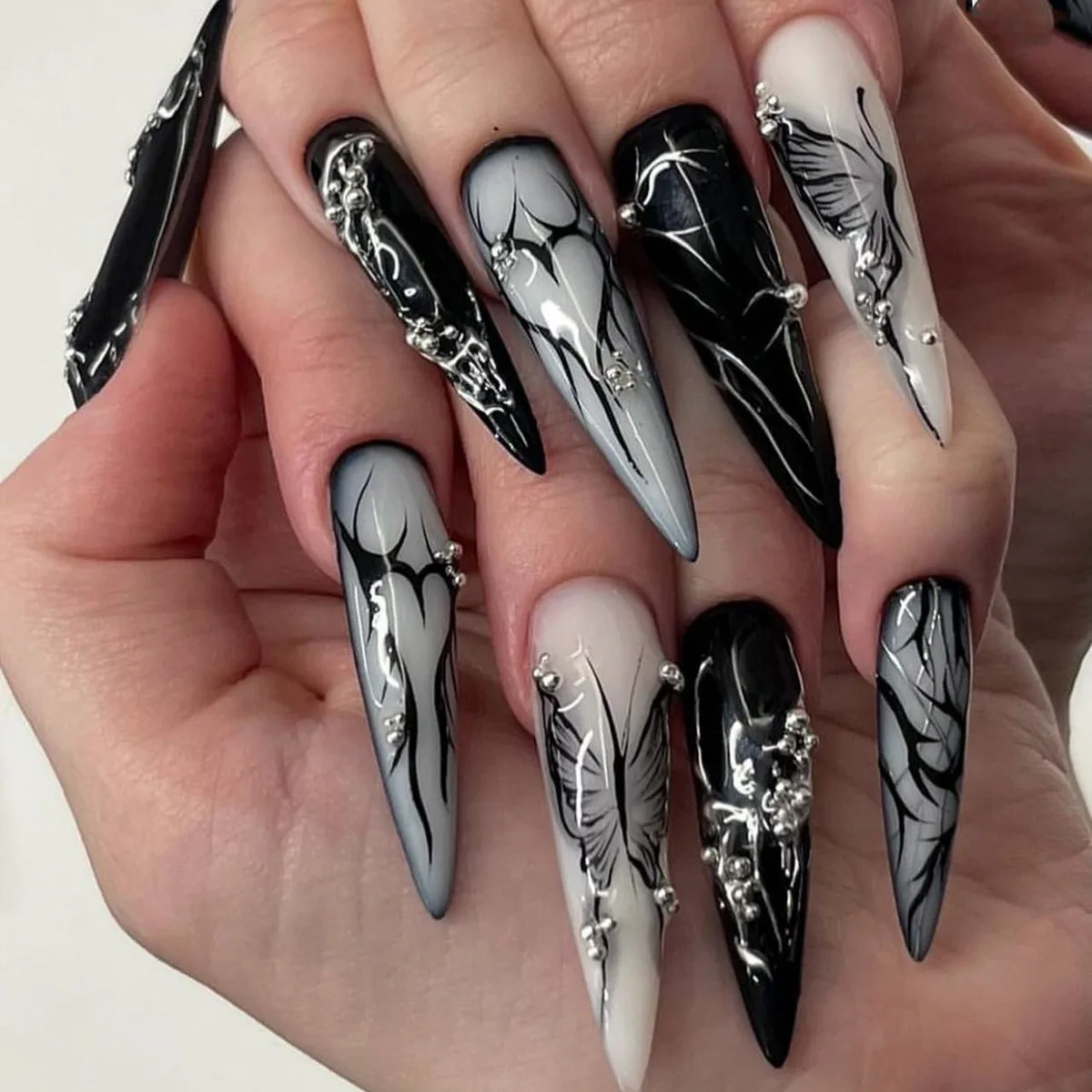 

24Pcs Extra Long Almond Press-on Nails: Gothic Black Butterfly with Irregular Veins & Pearl Rhinestones - Edgy Glam Style