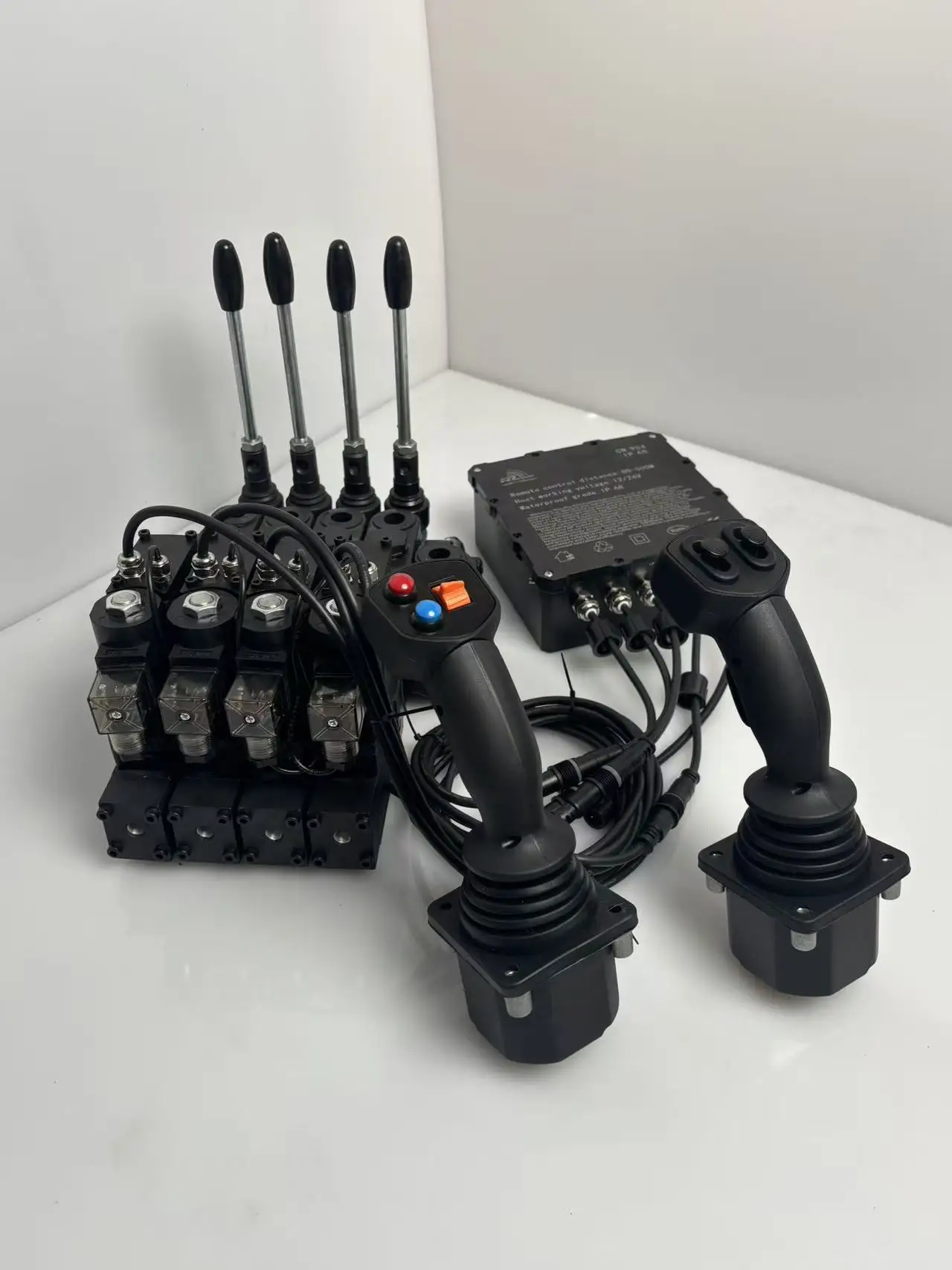 Remote Proportional Control System for an 80 L/min Hydraulic Valve, featuring a 4-Channel Configuration with a Universal Joystic