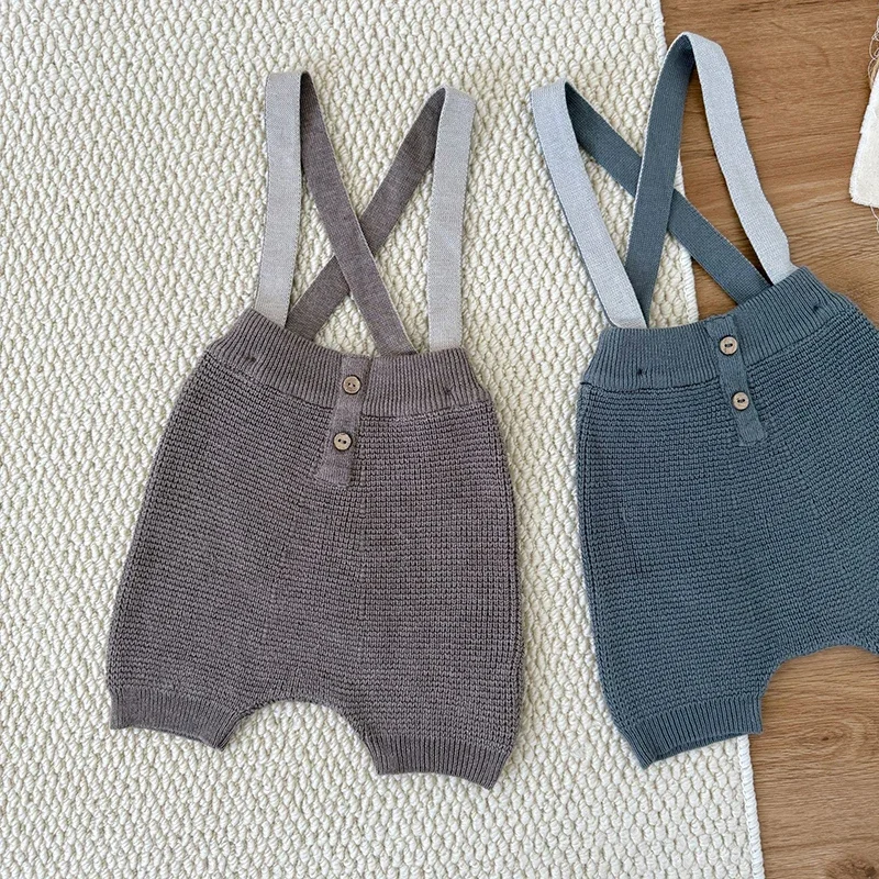 جديد ربيع 2026 بدلة قفز محبوكة للأطفال حديثي الولادة من الأولاد والبنات بدون أكمام بلون سادة ملابس أطفال على الطراز الكوري 0-24 متر