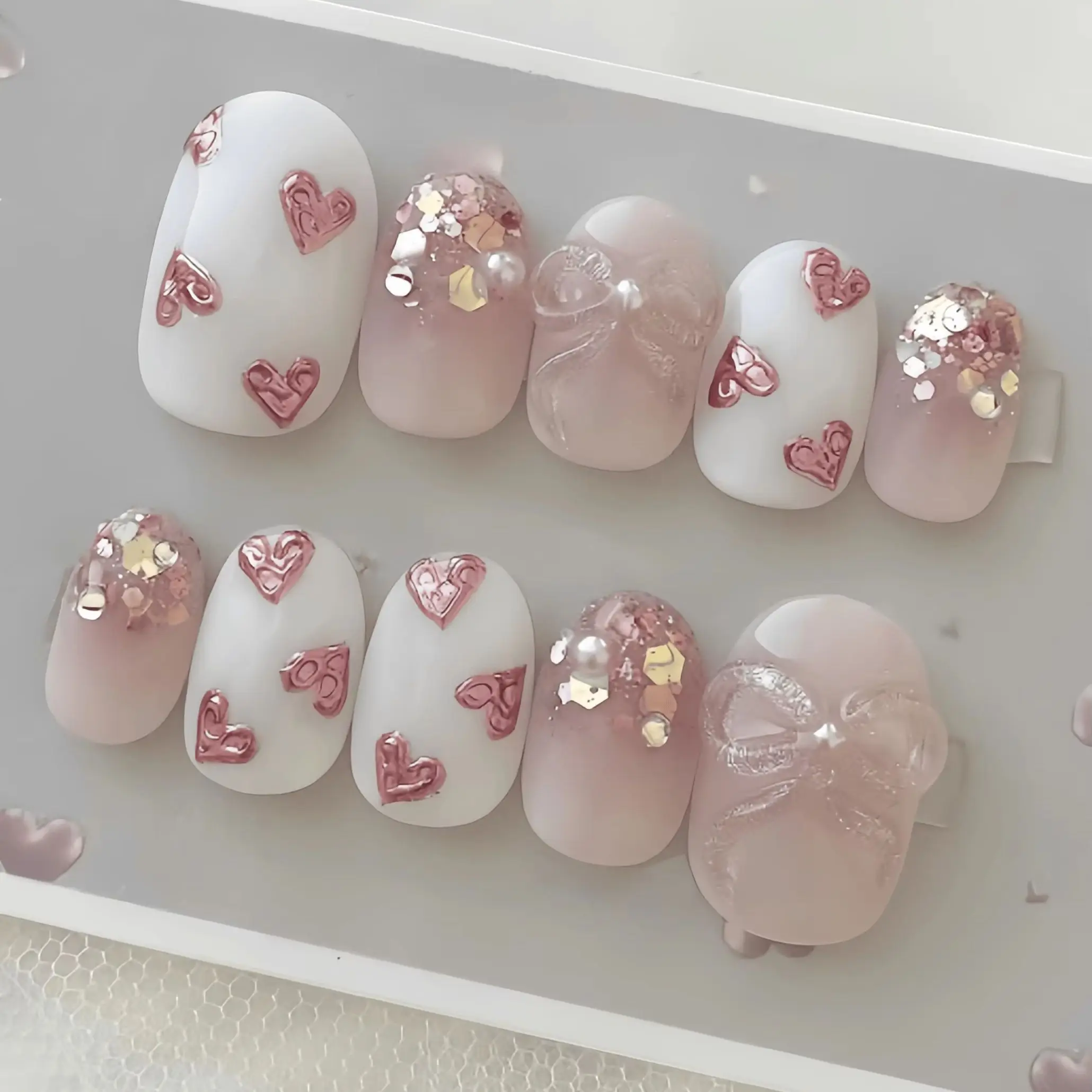 10 Pieces of Handmade Almond-Shaped Full-Cover Nail Tips, Medium Length, with Nude Pink Gradient and Translucent Base, Featuring Embossed Pink Hearts, Glitter Sequins, and Fine Glitter Bow Pearl Decorations, in a Gentle and Sweet Style, Suitable for Women and Girls, Perfect for Summer Vacations, Graduation Season, and as a Gift, Comes with 1 Piece of Jelly Glue and 1 Nail File
