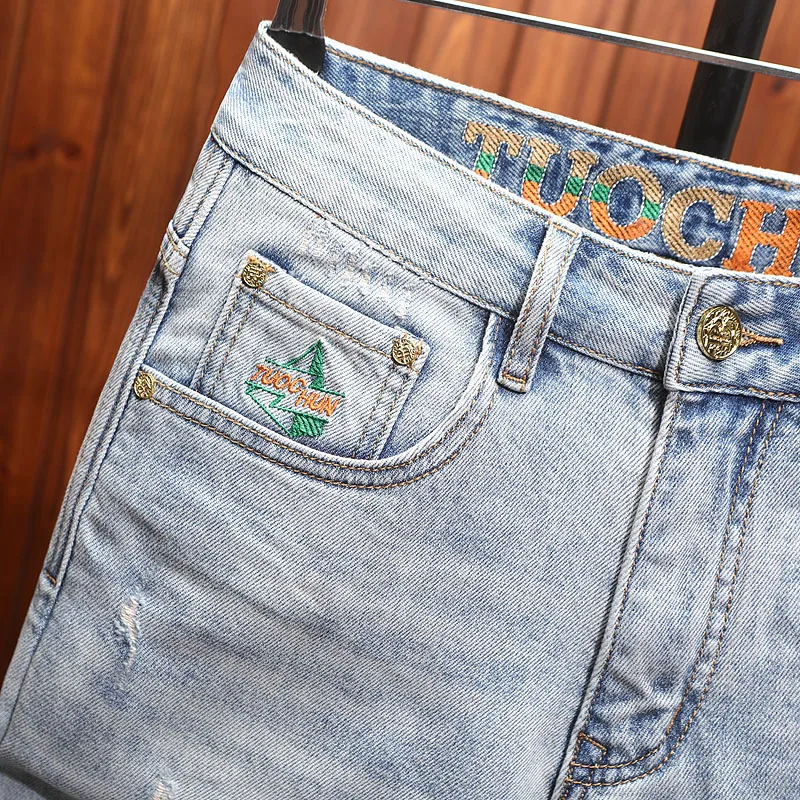 High end trendy men's denim shorts with men's stretch hole patch, summer trend washed five quarter horse pants