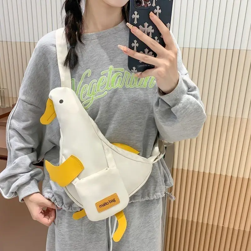 個性的なキャンバス製クロスボディバッグ、キュートなアヒル柄学生用ウエストバッグ、シングルショルダーフォンバッグ、ファッショナブルな新作人気インターネットバックパック