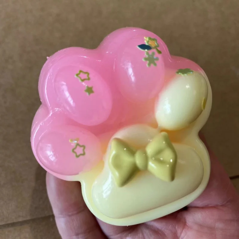 1pc kleurrijk kattenpootknijpspeeltje - zacht, decompressiebureauventilatiespeeltje met strik en sterren, ideaal voor studenten en volwassenen, perfect