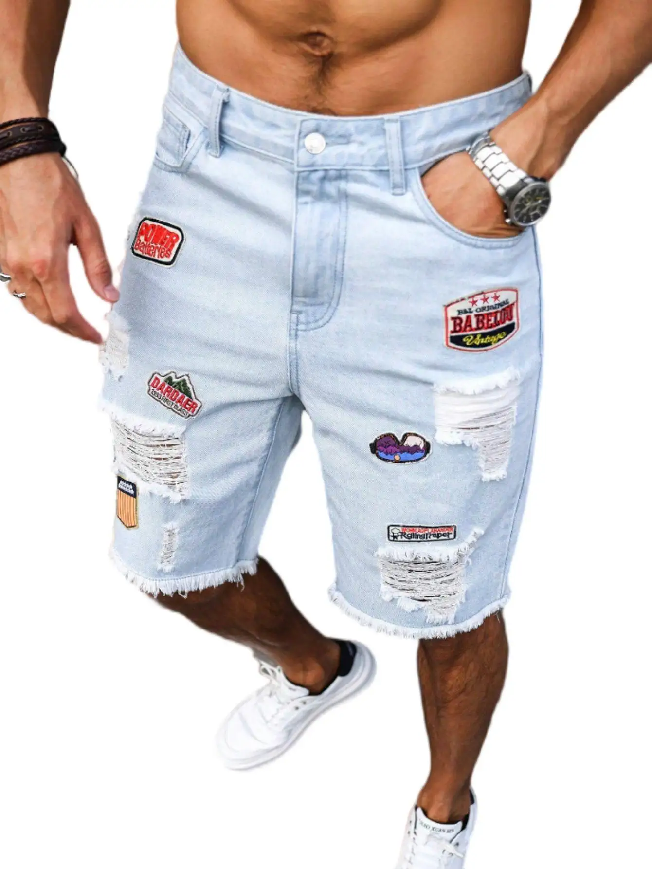 Men's light blue ripped denim shorts with patches for summer. Frayed edge design, showcasing street - style and a casual vibe.