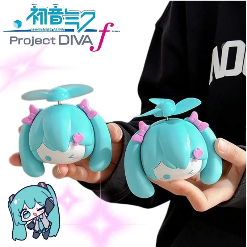 

2026 New Hatsune Miku Mini Handheld Fan Ultra-Strong Wind USB Rechargeable Portable Anime Fan for Students Backpack Gift