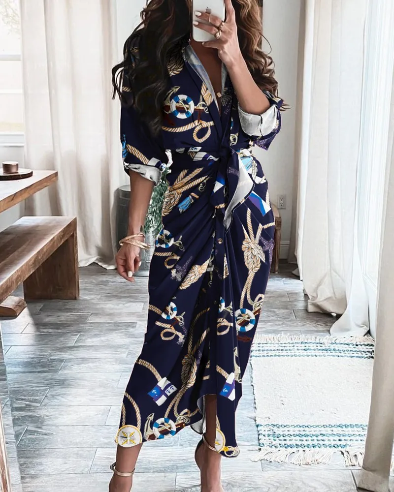 Chique geometrische en luipaardprint patchwork wikkeljurk met V-hals, opgerolde mouwen, tailleband en knoopdetail voor feestjes - afbeelding 1