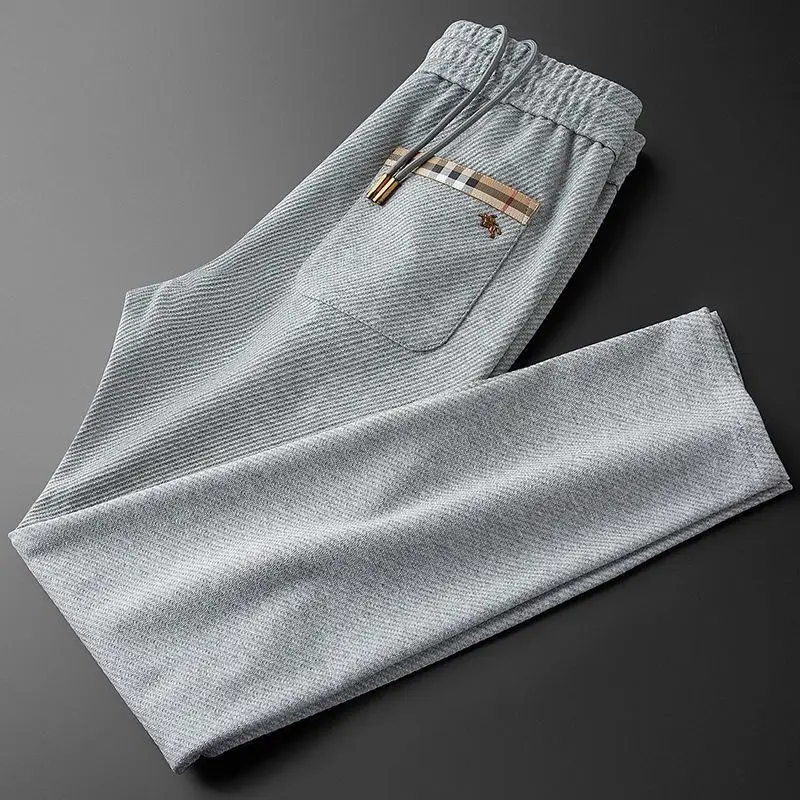 2024 autumn and winter new light luxury fashion solid color metal logo versatile casual straight elastic waist guard pants men