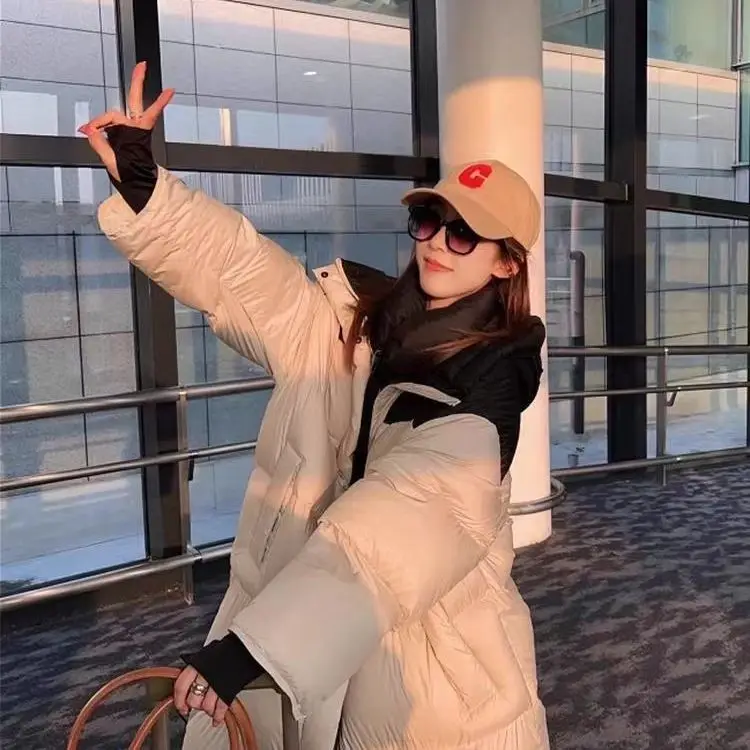 ​ ​ ผ้าฝ้ายหนาเสื้อผู้หญิง 2025 ใหม่ฤดูหนาวยาวด้านล่างเข่าหลวมเสื้อแฟชั่นปักหัวใจรัก ​ ​