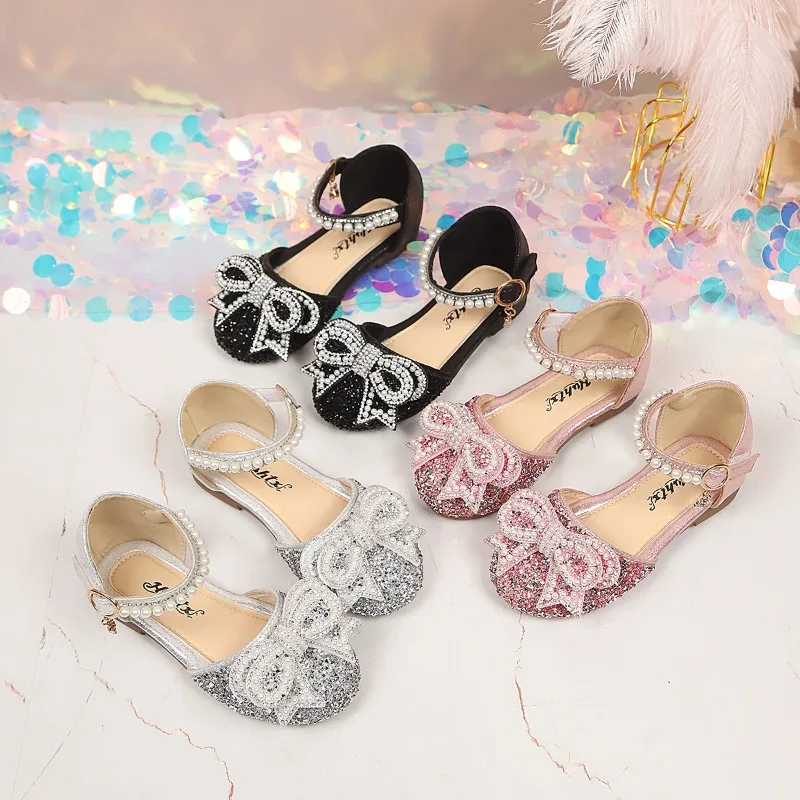 

Girls Fashion Dance Shiny Sweet Pearl Bows Kids Sandals for Party 2026 Summer New Children Soft Soled Comfortable Girls Shoes