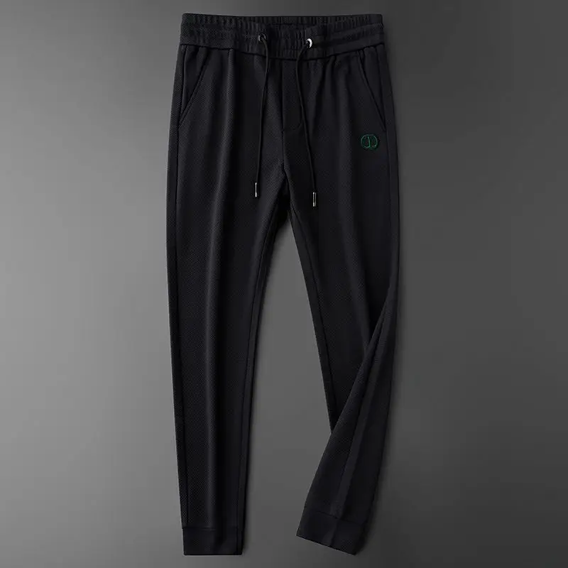 Pantalones delgados para hombre, pantalones deportivos informales con letras, pies de corbata ajustados, pantalones protectores de productos europeos de gama alta