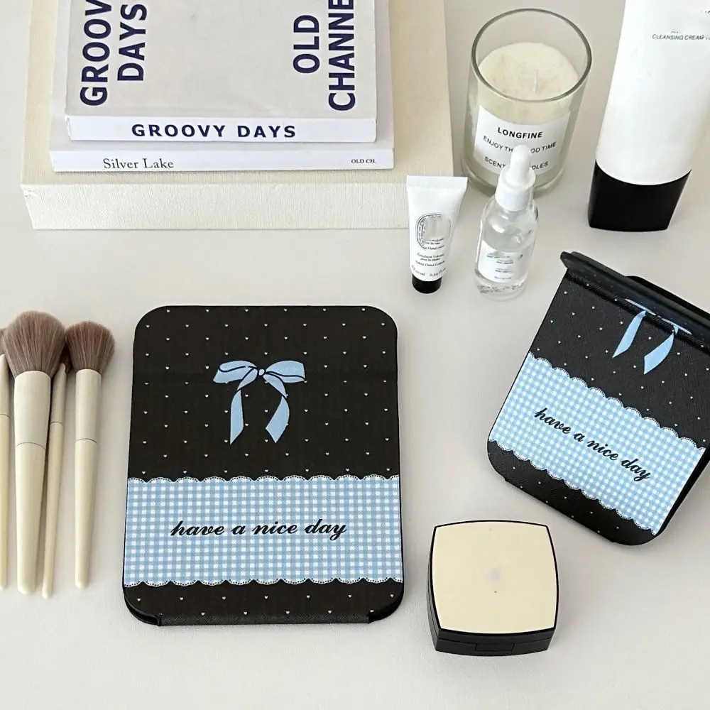 Espejo portátil de cuero Pu con soporte de escritorio, espejo de maquillaje plegable con lazo rosa, ligero, delicado espejo de maquillaje de bolsillo Unisex