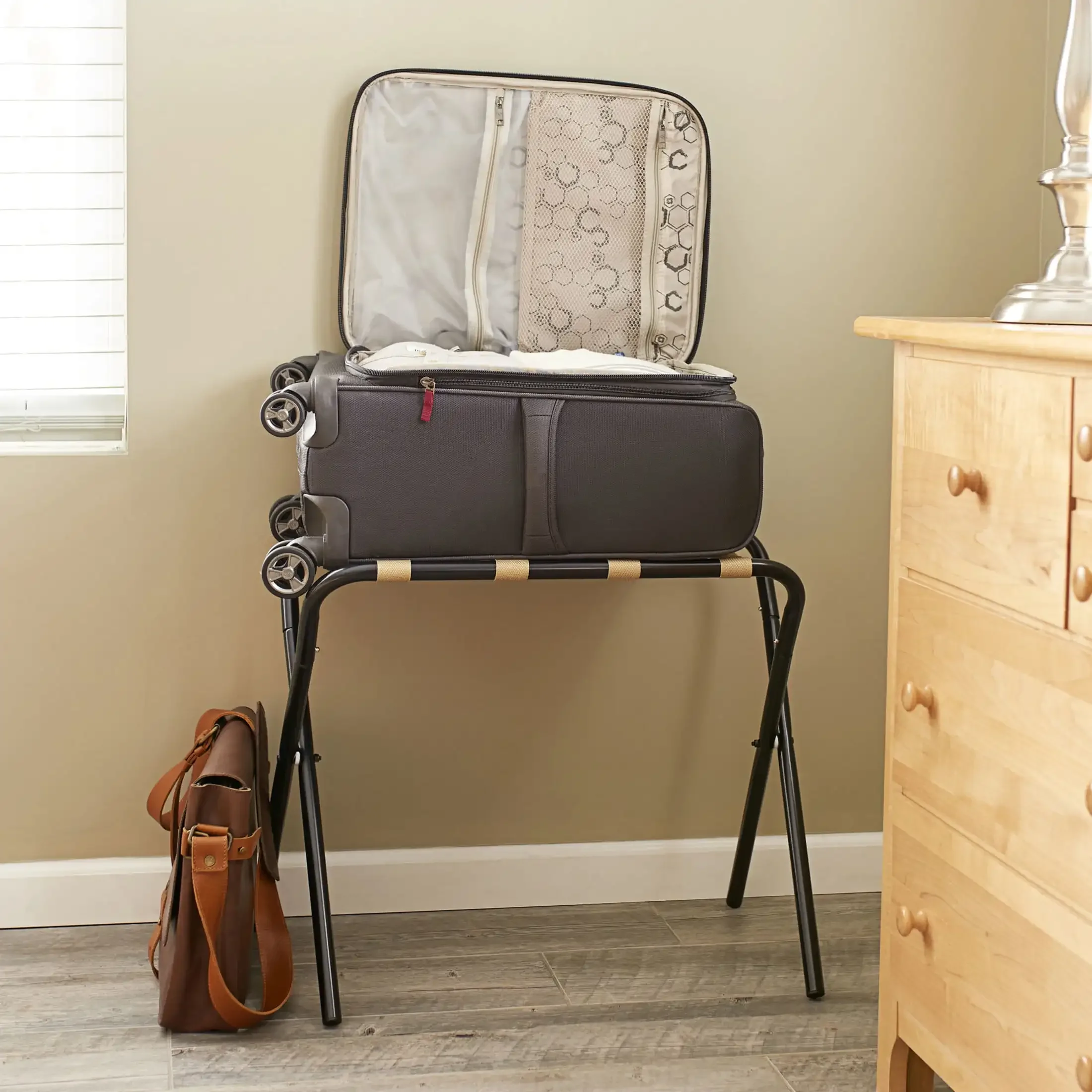 Luggage rack, black frame, chrome frame with khaki shoulder straps, stylish appearance
