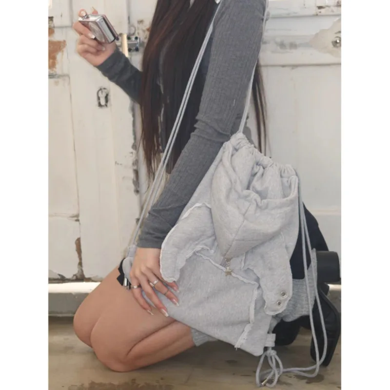 2025 Fashion Xzbag Korean Niche Angel Wing Backpack Simple And Versatile Drawstring Backpack Sweatshirt Hat Bag Y2k Girl Bag