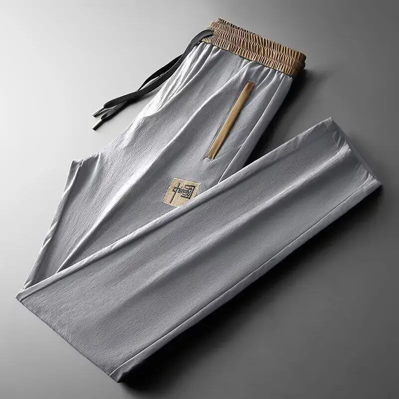 

Летние тонкие повседневные брюки из ледяного шелка для мужчин, износостойкие, свободного кроя, прямые штанины, на молнии, со средней посадкой, для строителей