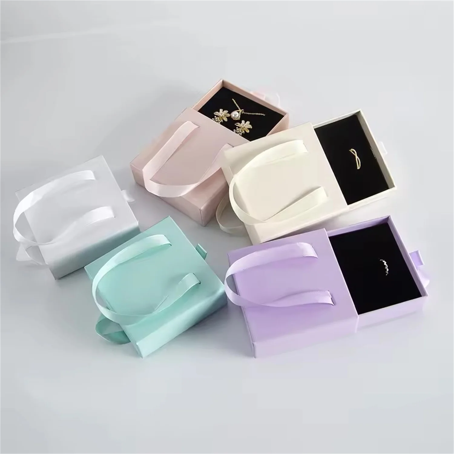

100Pcs Bulk Jewelry Box for Women Girls with Handle Small Travel Case Necklace Ring Earrings Organizer Sliding Drawer Present