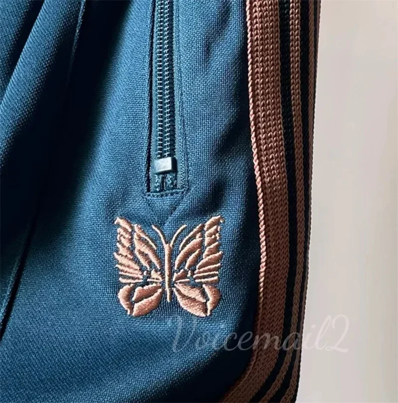 25ss เย็บปักถักร้อยผีเสื้อ Nee dles ขากว้างกางเกงลาย 1:1 Oversize Claret AWGE Casual กางเกงแท็ก